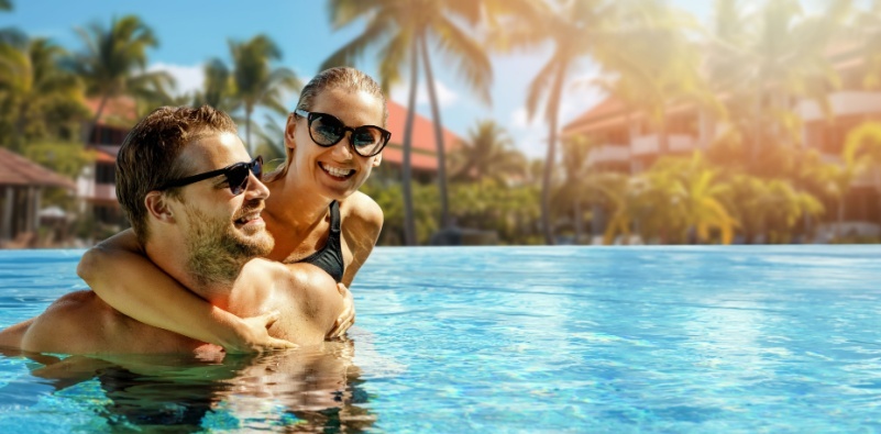 Couple sunbathing with Maui Jim Couple sunbathing with Maui Jim