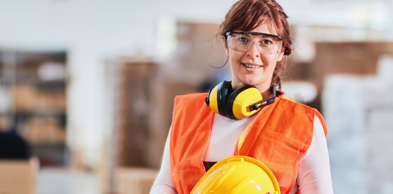Female worker wearing protective workwear Female worker wearing protective workwear